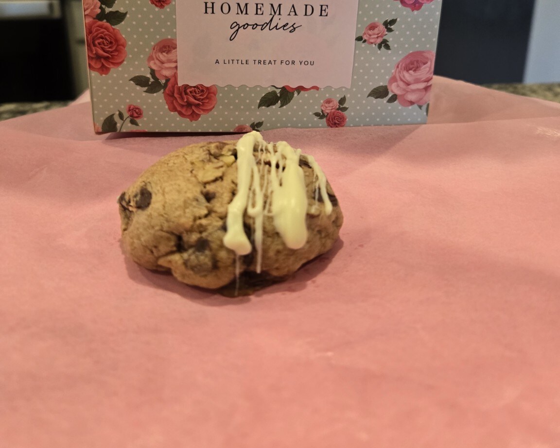Chocolate chip cookie with white chocolate drizzle